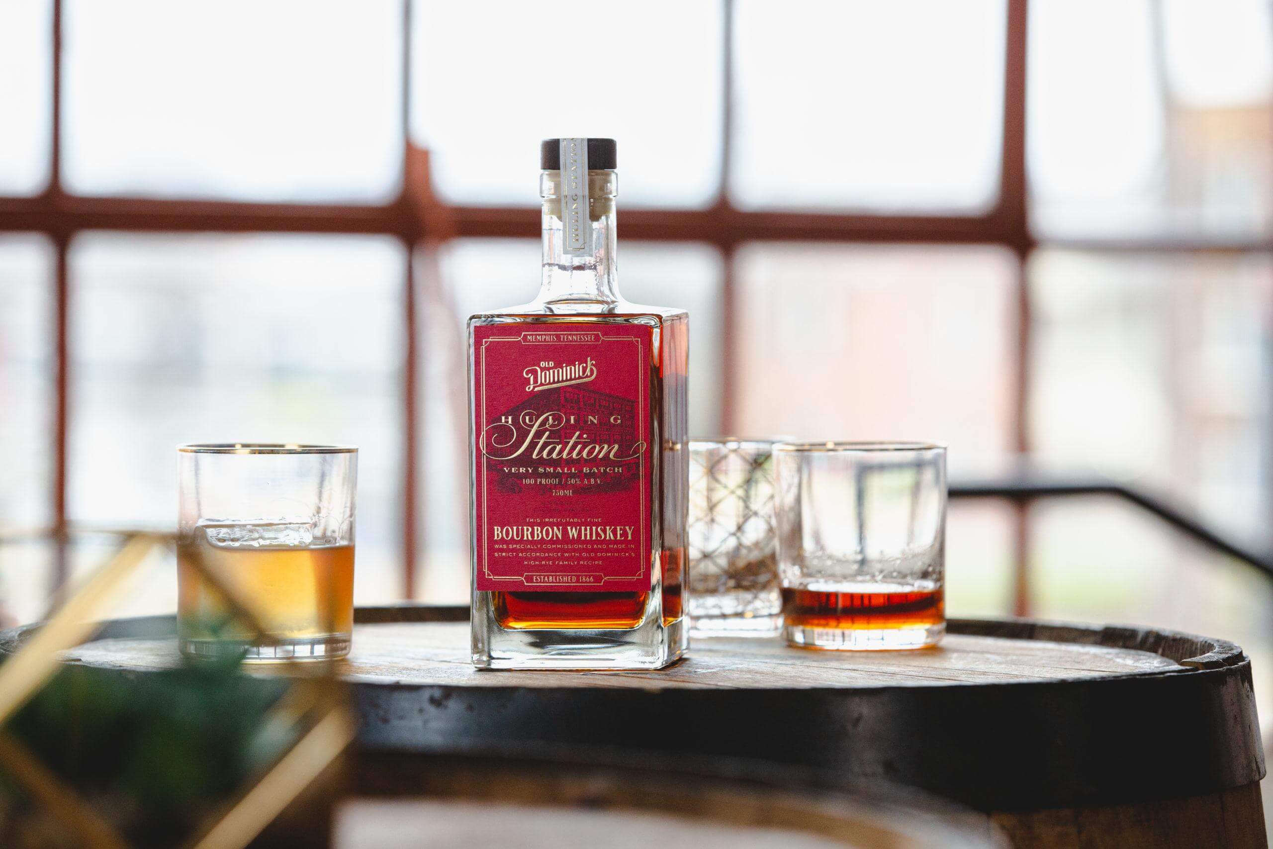 Hulling Station Bourbon Whiskey with glasses of whiskey