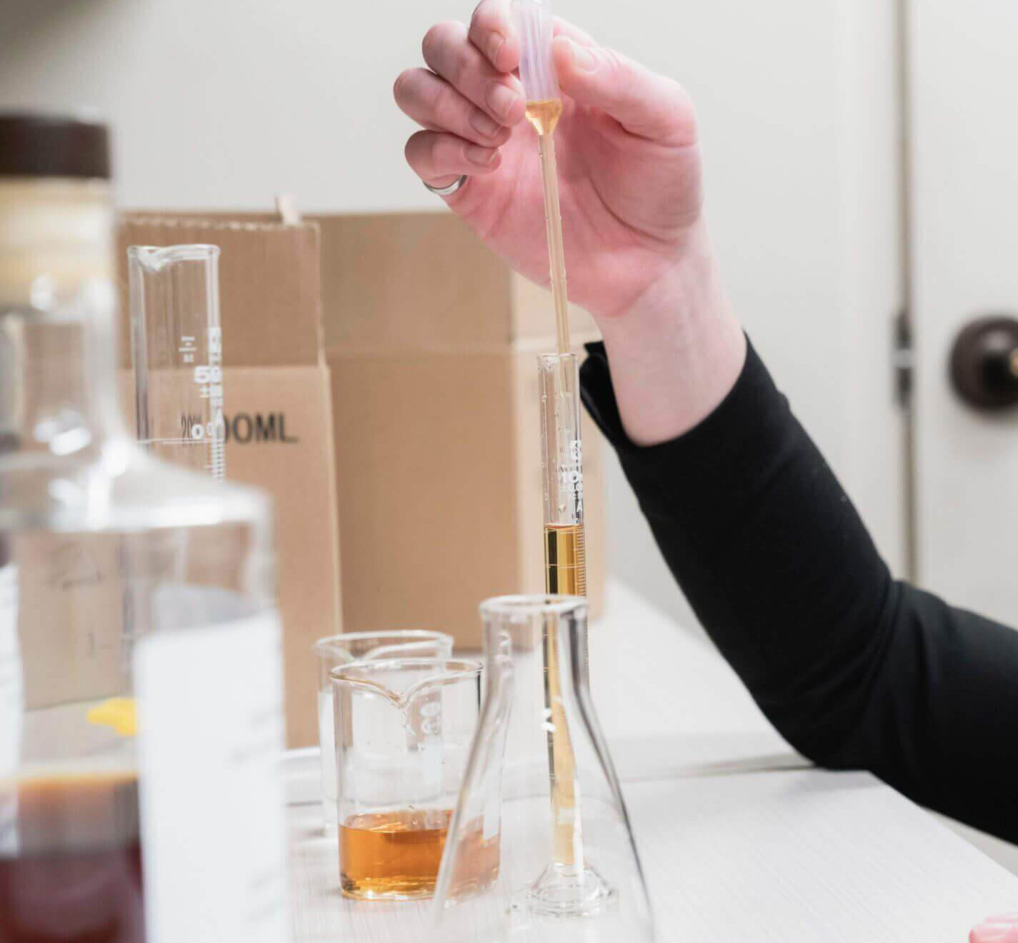 Examining a spirits sample in the lab